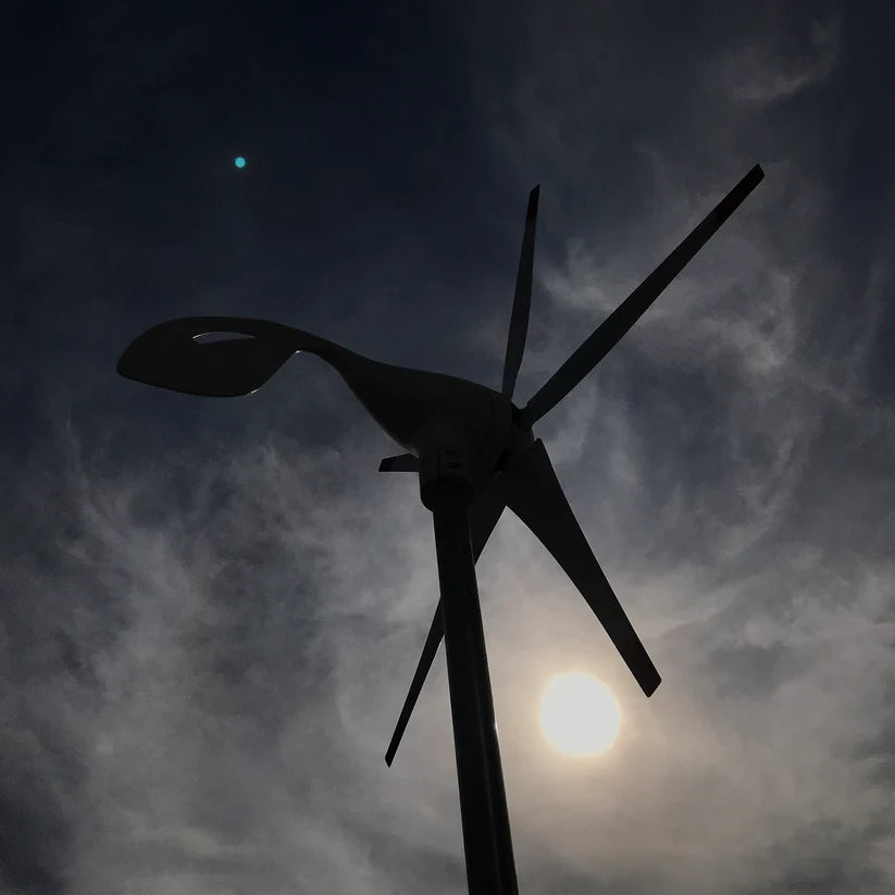 Nature's Generator 150W wind turbine producing renewable energy during nighttime conditions